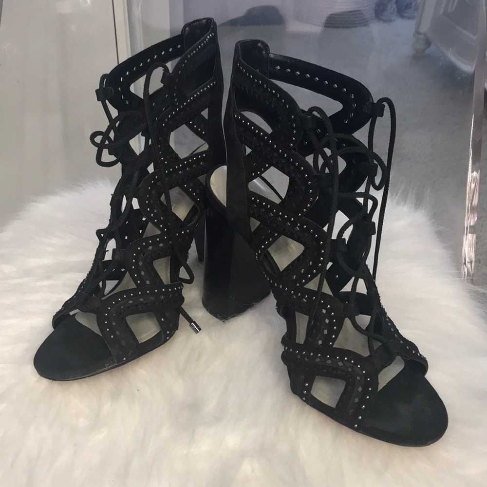 Black cris-cross tie up heels with studs